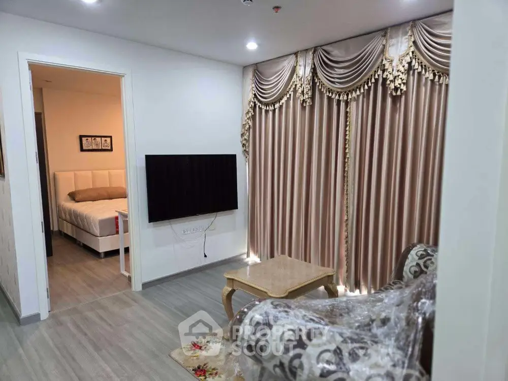 Elegant living room with luxurious curtains and cozy bedroom view
