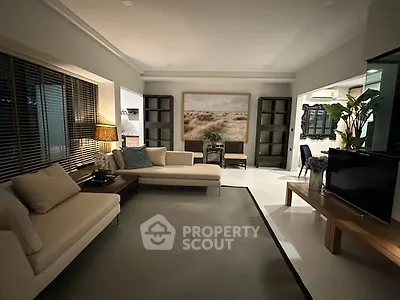 Spacious living room with modern decor and cozy seating area
