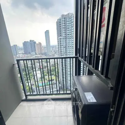 High-rise balcony with cityscape view and washing machine, perfect for urban living.