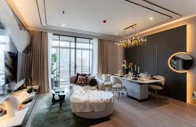 Luxurious modern living room with elegant dining area and city view balcony.