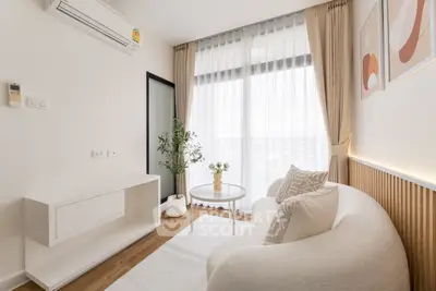 Stylish modern living room with cozy sofa and large window view