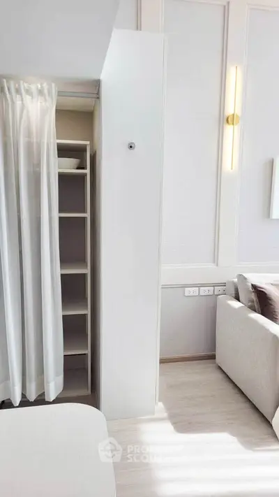 Modern living room with hidden storage and elegant lighting