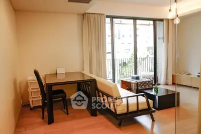 Stylish living room with modern furniture and large windows for natural light.