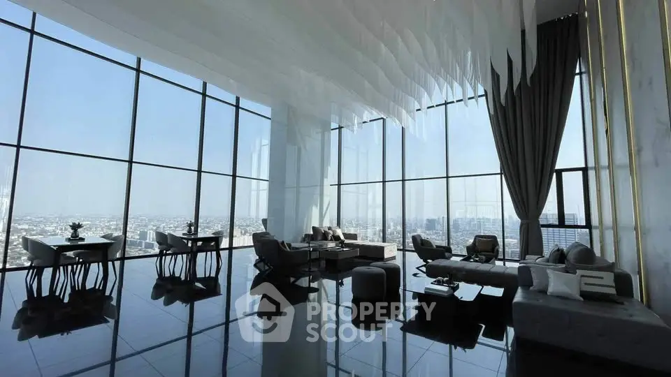 Luxurious high-rise living room with panoramic city views and modern decor.