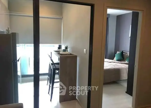 Modern apartment interior with cozy bedroom and dining area, perfect for urban living.