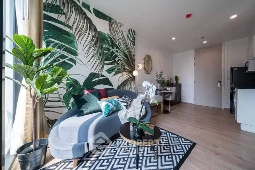 Stylish living room with tropical wallpaper, modern furniture, and abundant natural light.