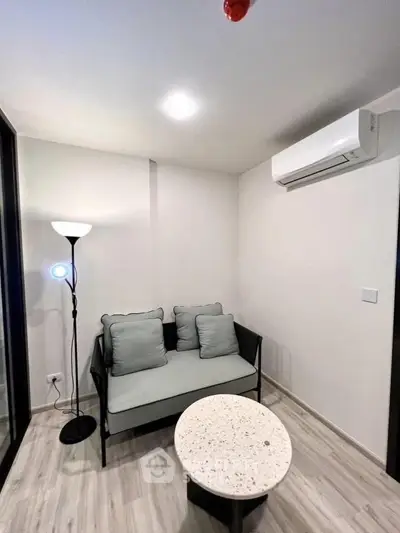 Cozy modern living room with stylish furniture and air conditioning