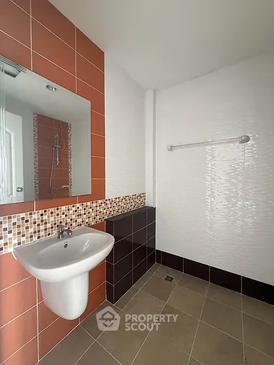 Modern bathroom with stylish tiles and sleek sink design