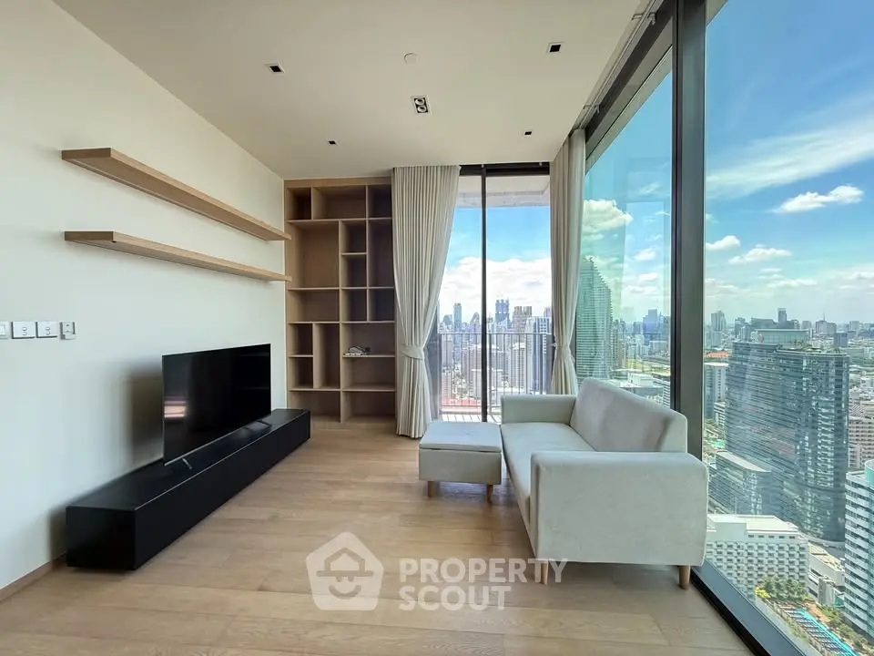 Modern living room with floor-to-ceiling windows and stunning city view.