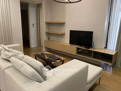 Modern living room with sleek TV unit and cozy sofa in stylish apartment
