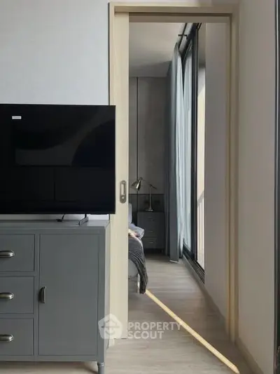 Modern bedroom with sliding door and sleek furniture design