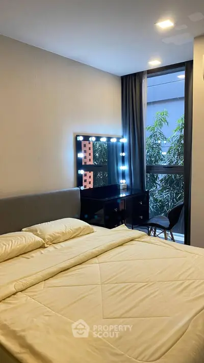 Modern bedroom with stylish vanity and large window view