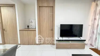 Modern living room with sleek TV setup and wooden accents