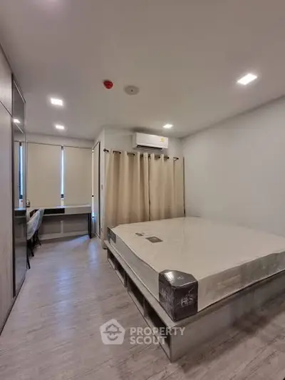 Modern bedroom with sleek design and ample natural light