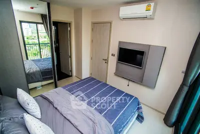 Modern bedroom with air conditioning and balcony view in a stylish apartment.