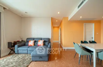 Spacious living room with modern decor and dining area in open layout