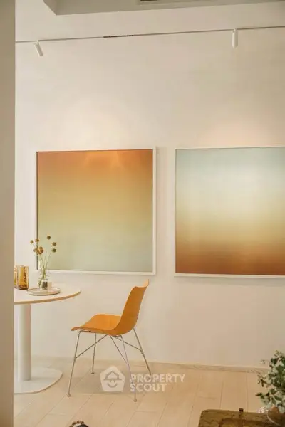 Stylish modern interior with minimalist decor and abstract art, perfect for contemporary living spaces.