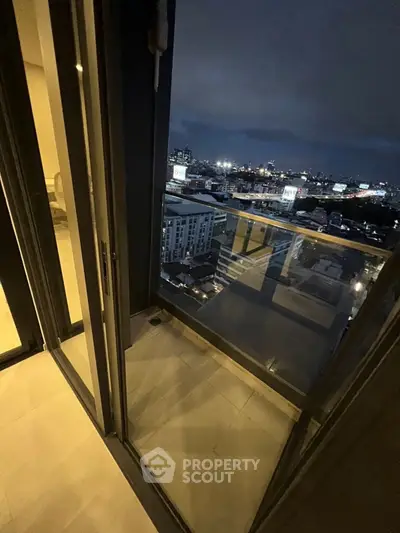 Stunning city view from modern apartment balcony at night