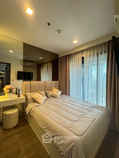 Luxurious bedroom with elegant decor and large window view