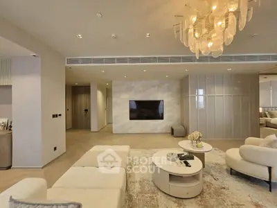 Luxurious modern living room with elegant chandelier and stylish furniture