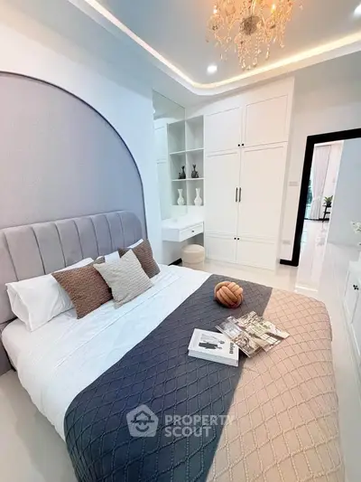 Luxurious bedroom with elegant decor and built-in wardrobe, perfect for modern living.