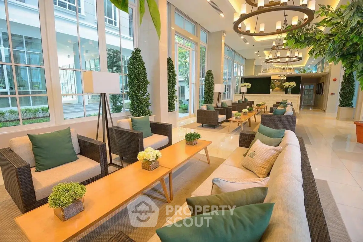 Luxurious lobby with elegant seating and greenery in modern building