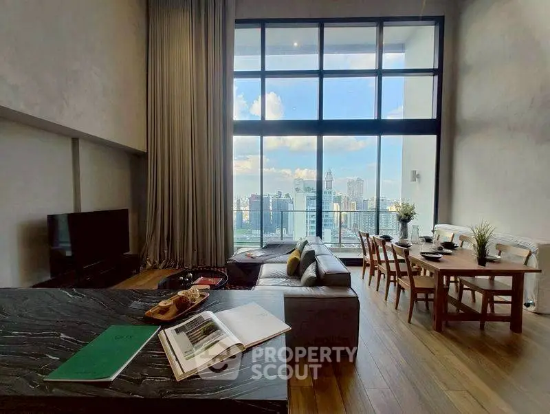 Spacious living room with stunning city view and elegant decor