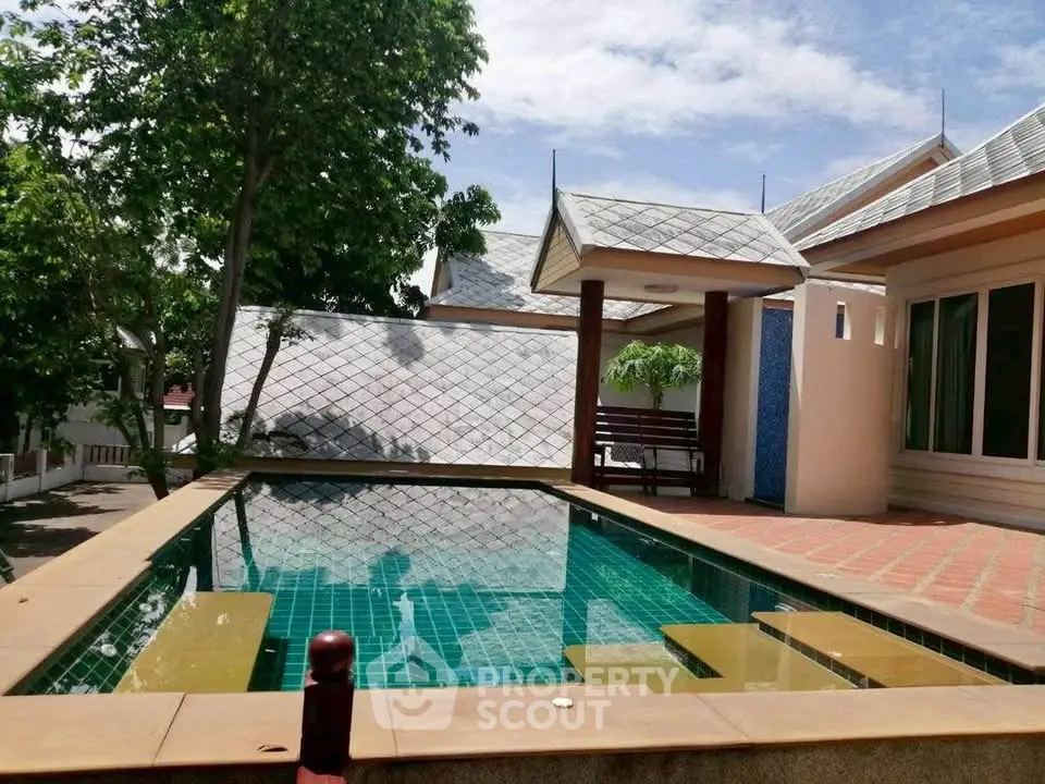 Charming villa with private pool and lush greenery, perfect for relaxation and luxury living.