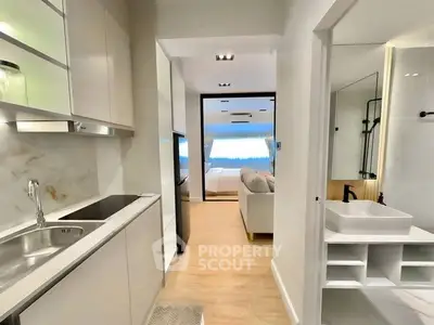 Modern open-layout apartment with sleek kitchen and cozy living area