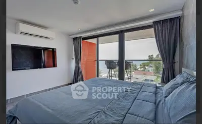 Luxurious bedroom with stunning ocean view and modern amenities