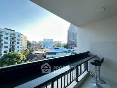 Spacious balcony with city view, perfect for relaxation and enjoying the skyline.
