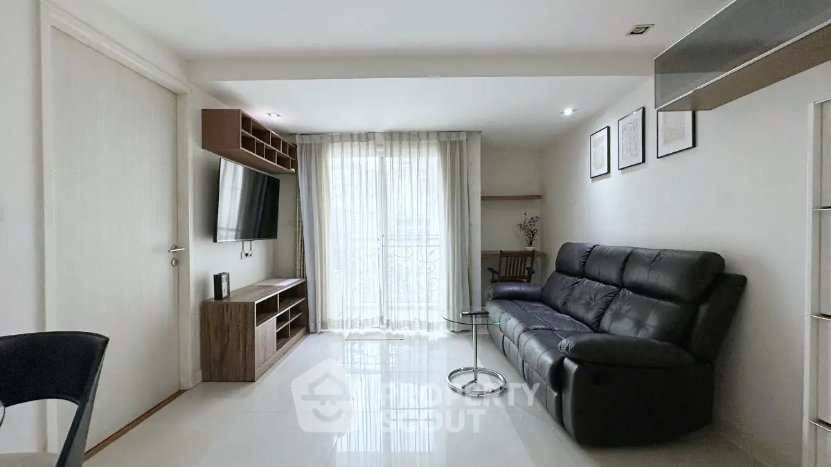 Modern living room with sleek furniture and natural light, perfect for urban living.