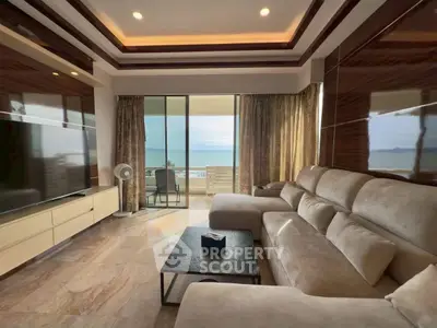 Luxurious living room with ocean view, modern furniture, and elegant decor in a high-end property.