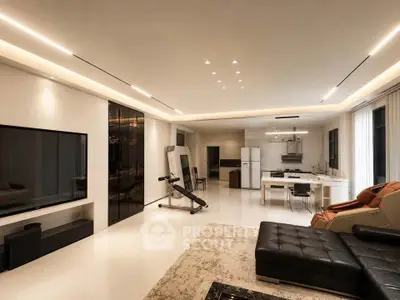 Luxurious open-plan living room with modern furniture and sleek kitchen design.