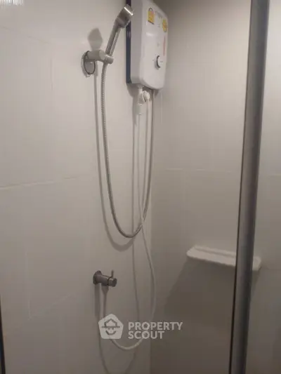 Modern bathroom shower with water heater and sleek design