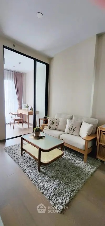 Modern living room with cozy sofa and stylish decor in open layout apartment