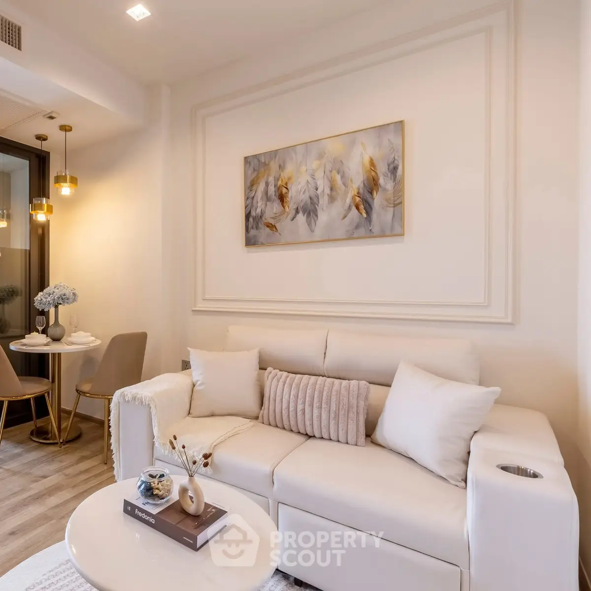 Elegant living room with cozy white sofa and chic dining area, perfect for modern living.