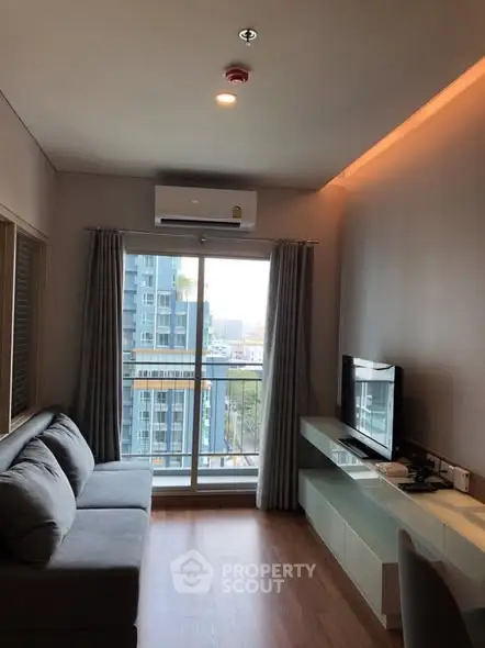 Modern living room with city view and sleek furniture