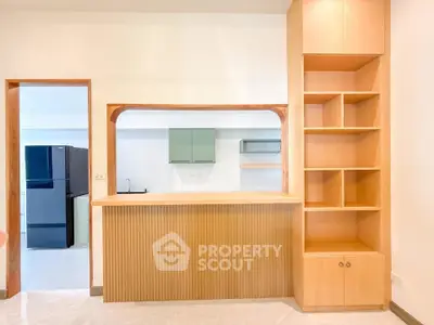 Spacious kitchen with open layout and modern appliances in a stylish apartment.