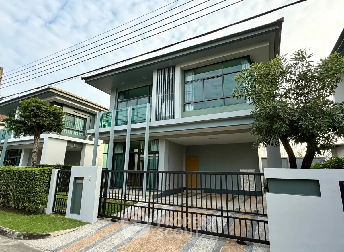 Modern two-story house with sleek design and spacious driveway