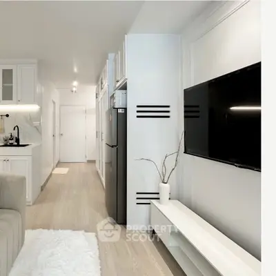 Modern living room with sleek TV setup and compact kitchen area