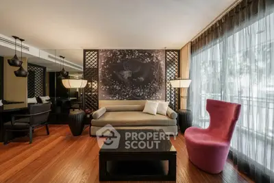 Luxurious living room with elegant decor and large windows for natural light.