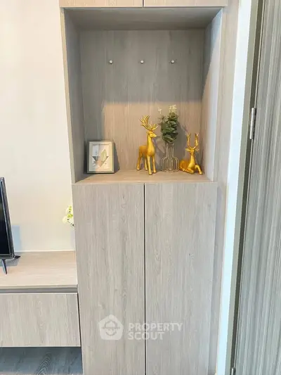 Modern living room with stylish wooden cabinet and decorative accents