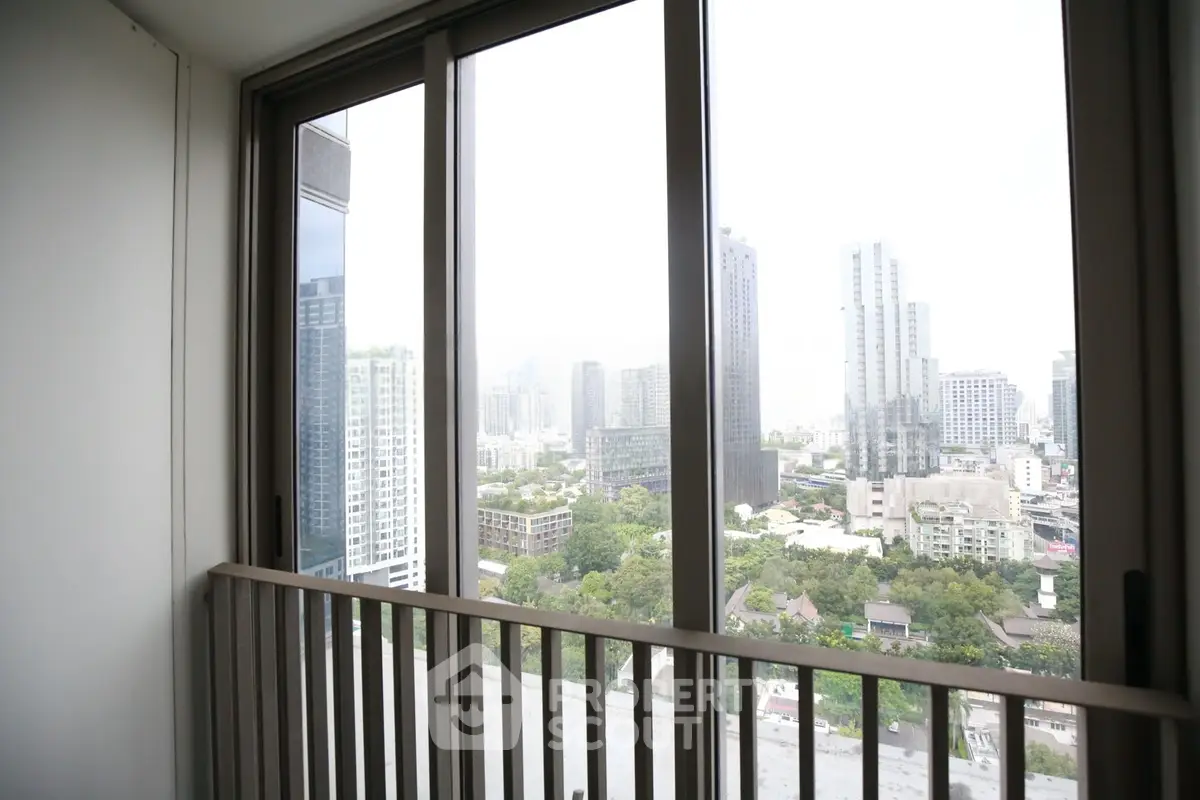Stunning cityscape view from a modern balcony in a high-rise apartment.