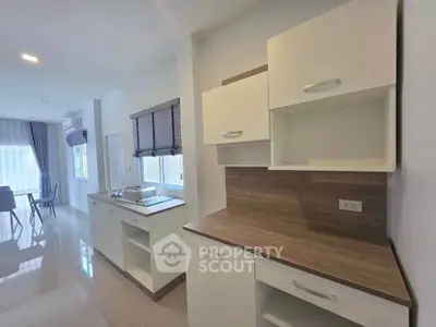 Modern kitchen with sleek cabinets and open layout in bright apartment