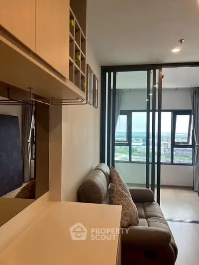 Modern living room with sliding glass doors and city view
