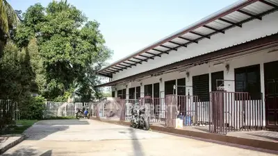 Charming single-story building with modern design and lush greenery