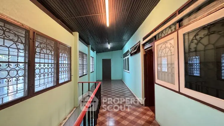Spacious corridor with vintage design and natural light