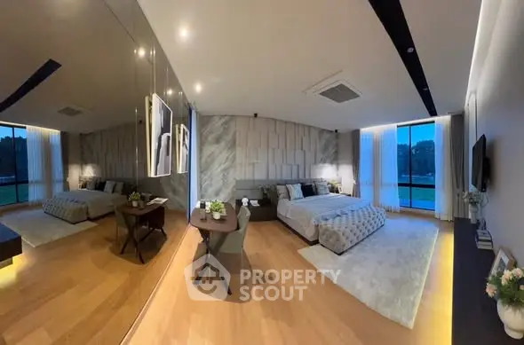 Luxurious modern bedroom with elegant decor and large windows offering stunning views.