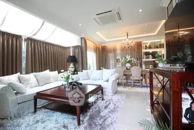 Luxurious living room with elegant decor and ample natural light